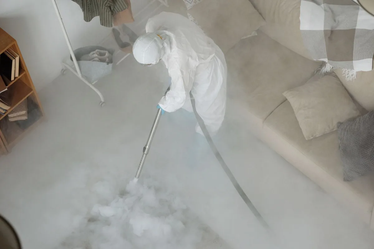 Biohazard cleanup technician in protective equipment, Silver Lake, NJ